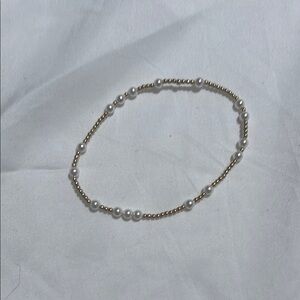 Elegant Gold and White Braided Bracelet